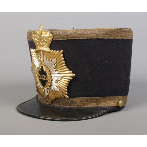 171 - A Victorian military style shako. The inside stamped for William Mutrie & Son.