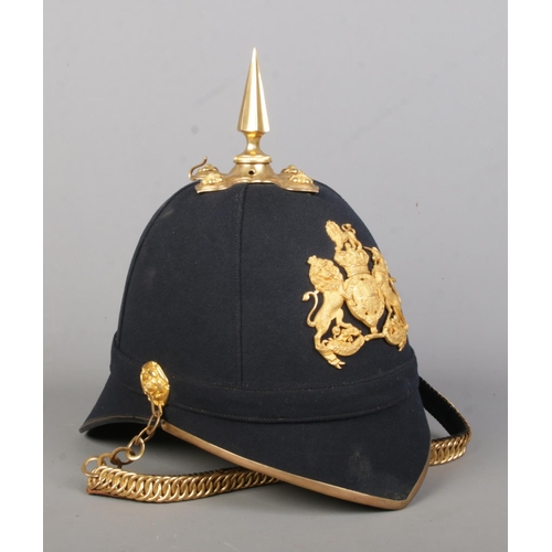 178 - A British Royal Artillery helmet with blue cloth and spike. Inside of helmet marked for Guthrie & Va... 