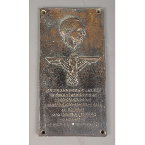 182 - A German bronze plaque commemorating the chancellery of Adolf Hitler. 29cm x 15cm.