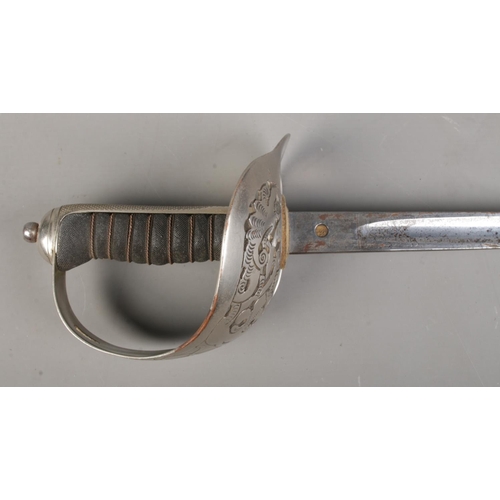 192 - A George VI 1897 pattern Infantry Officer's sword. Having GRVI crowned cypher and etched blade. With... 