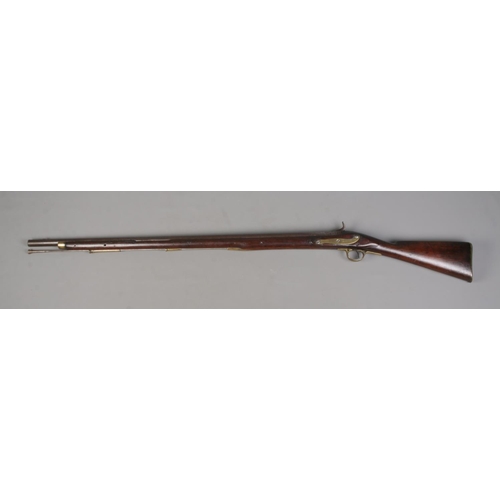 195 - A 19th century rifle with walnut stock. Percussion conversion from flint lock. The lock plate bearin... 