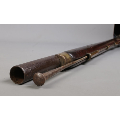 195 - A 19th century rifle with walnut stock. Percussion conversion from flint lock. The lock plate bearin... 