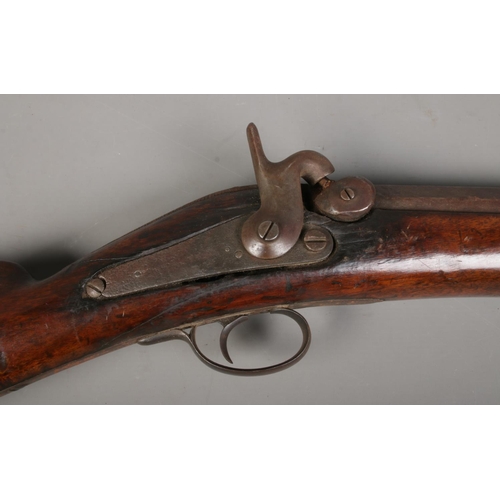 196 - An 19th century heavy percussion rifle with octagonal barrel. Barrel length 72cm. CANNOT POST.