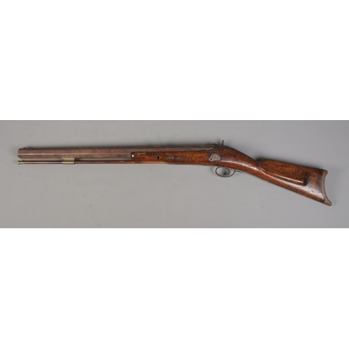 196 - An 19th century heavy percussion rifle with octagonal barrel. Barrel length 72cm. CANNOT POST.