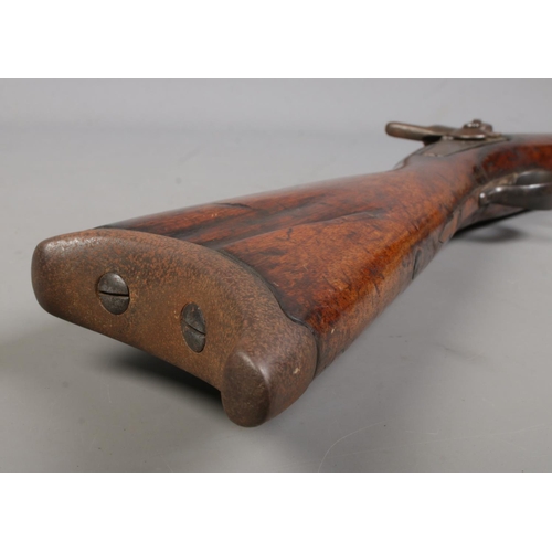 196 - An 19th century heavy percussion rifle with octagonal barrel. Barrel length 72cm. CANNOT POST.