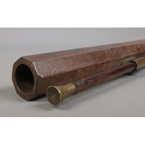 196 - An 19th century heavy percussion rifle with octagonal barrel. Barrel length 72cm. CANNOT POST.