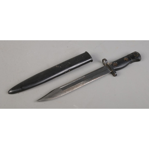 197 - A British L1A3 SLR bayonet with scabbard. Blade length 20cm. CANNOT POST OVERSEAS.