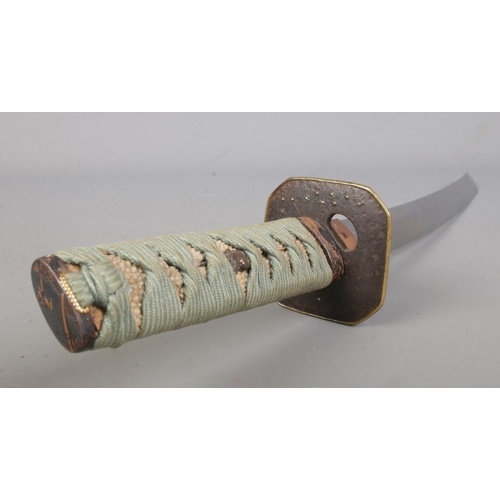 200 - A Japanese Meiji period Wakizashi. Having bronze Tsuba and wrapped Samegawa Tsuka with bird Menuki. ... 