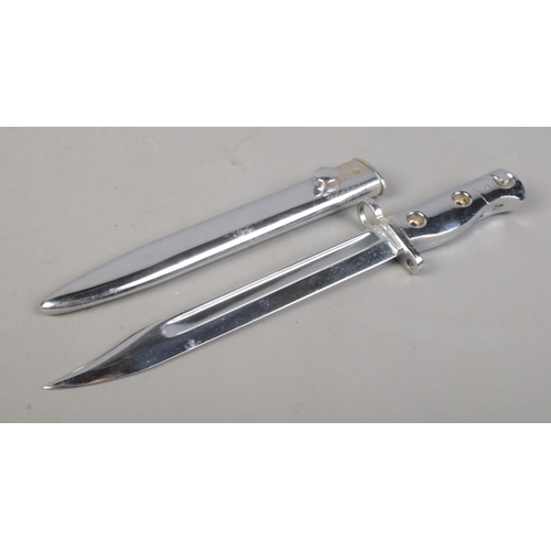 201 - A British L1A3 SLR ceremonial issue bayonet with scabbard. Blade length 20cm. CANNOT POST OVERSEAS.