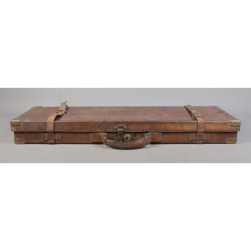 203 - A 19th century leather gun case with fitted interior. Marked for WJ Worden, Southport and having bra... 