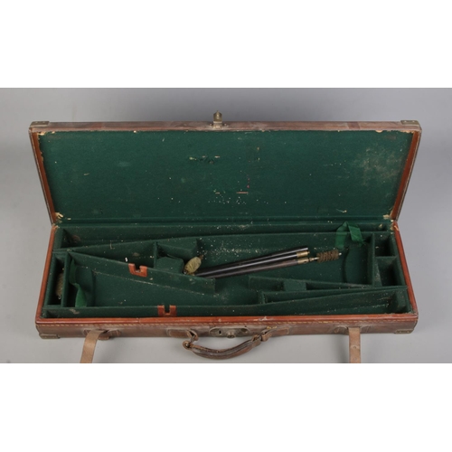 203 - A 19th century leather gun case with fitted interior. Marked for WJ Worden, Southport and having bra... 