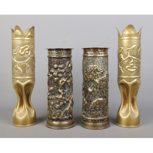 207 - Two pairs of World War One trench art artillery shells. One pair extensively decorated with flowers.... 