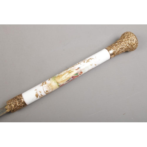 209 - A bamboo cased sword stick. Having porcelain grip, hand painted with Sevres style scenes and gilt me... 