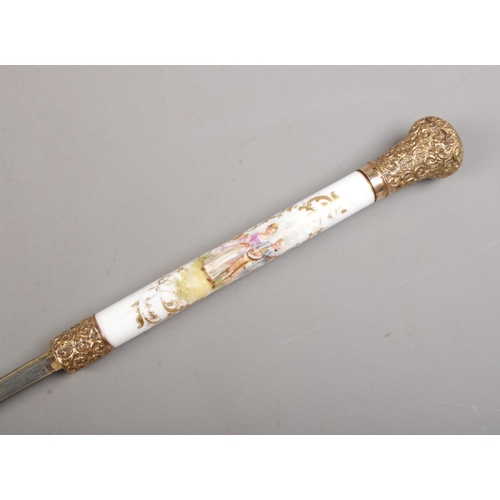 209 - A bamboo cased sword stick. Having porcelain grip, hand painted with Sevres style scenes and gilt me... 