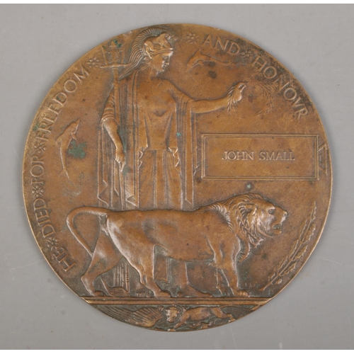 213 - A World War One bronze memorial plaque/death penny awarded to John Small.