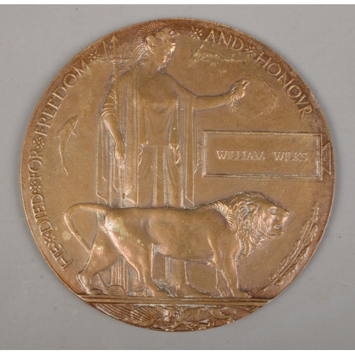 219 - A World War One bronze memorial plaque/death penny awarded to William Wilks.