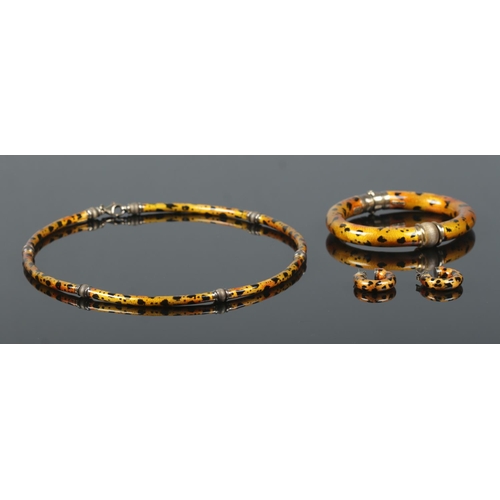 241 - A vintage silver and enamel jewellery suite by Gaston Lebo for Pauly. Having cheetah print decoratio... 