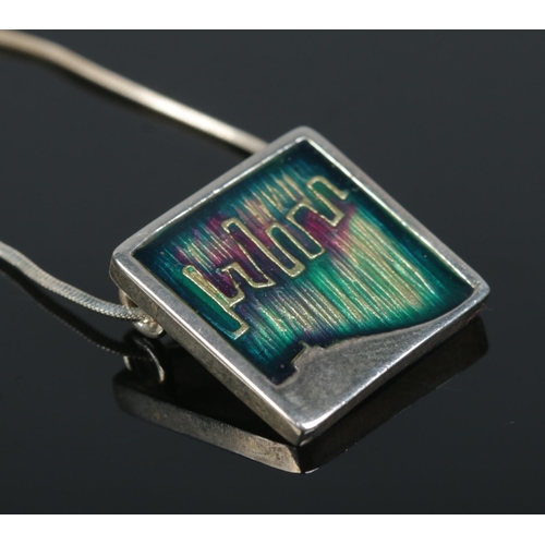 244 - A enamelled silver pendant on silver chain by Shetland Silvercraft. Assay marks for Edinburgh 2013.