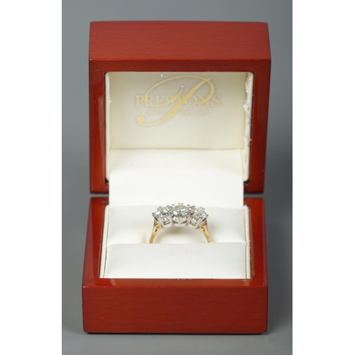 251 - An 18ct gold three stone diamond ring. Approximately 1.9ct diamond in total. Has original sale recei... 