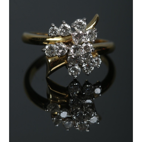 254 - An 18ct gold and diamond trumpet cluster ring. Size R 1/2. 7.03g.