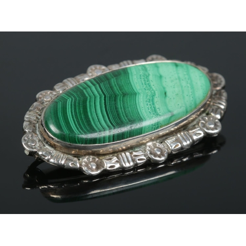 258 - A mid century Robert Allison silver and malachite brooch along with a silver and amethyst pendant on... 