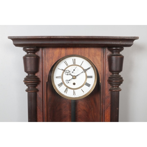 268 - A 19th century German walnut Vienna single weight wall clock.