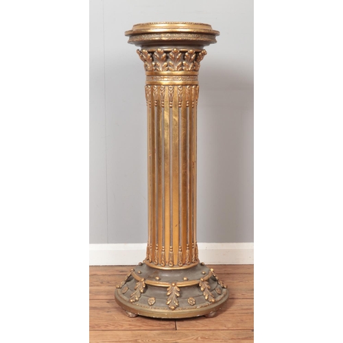 282 - A large pair of gilt wood Corinthian columns. Height 101cm.