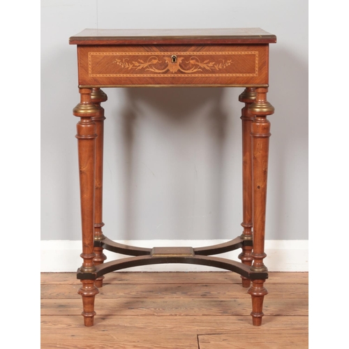 285 - An Edwardian marquetry inlaid vanity table. With fitted mirrored and fitted interior. Height 75cm.