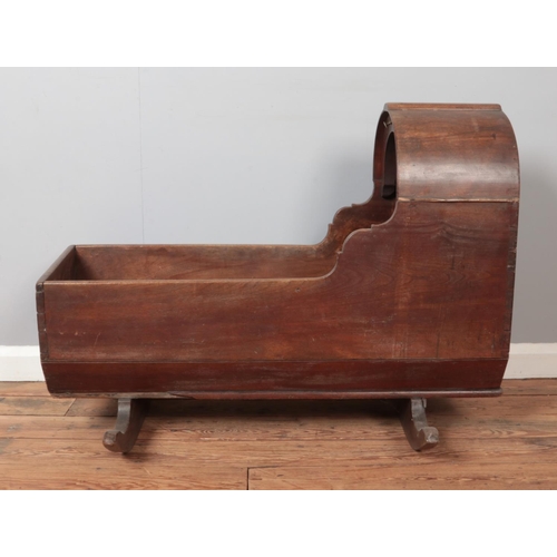 286 - A Victorian mahogany and pine rocking crib. Height 74.5cm, Length 100cm.