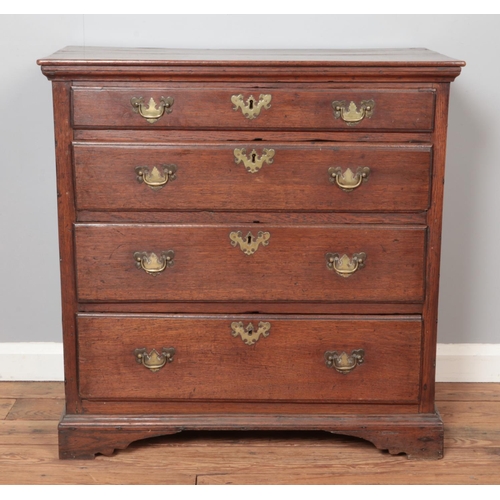 291 - A small Georgian oak chest of four graduated drawers. Height 84cm, Width 83cm, Depth 48cm.