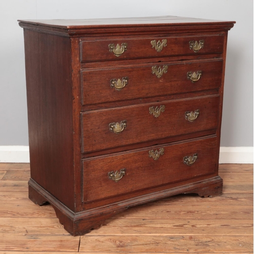 291 - A small Georgian oak chest of four graduated drawers. Height 84cm, Width 83cm, Depth 48cm.