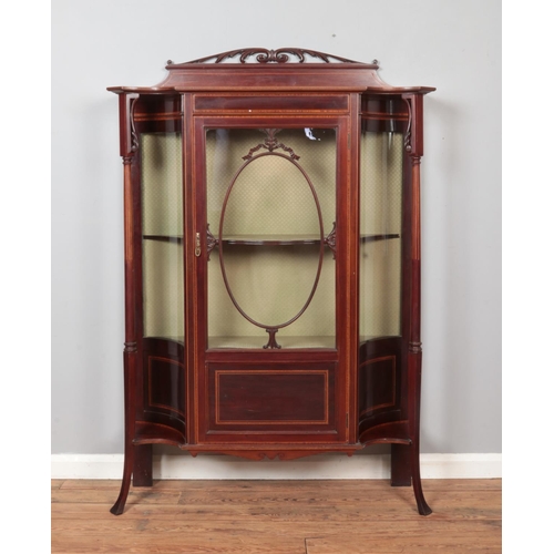 294 - An Edwardian carved and inlaid mahogany display cabinet. Height 149cm, Width 113cm, Depth 38cm.