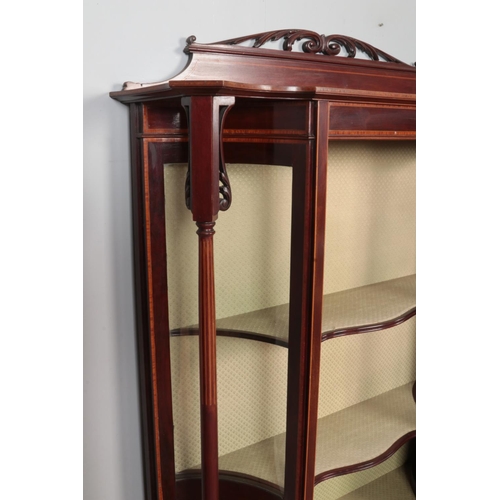 294 - An Edwardian carved and inlaid mahogany display cabinet. Height 149cm, Width 113cm, Depth 38cm.