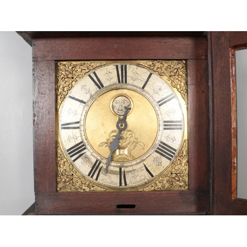 295 - An extensively carved mahogany long case clock, the brass dial marked for William Burton, Kendal. Ha... 