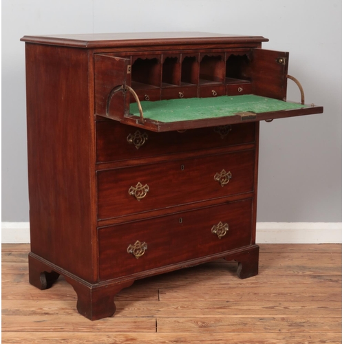 296 - A Georgian mahogany secretaire chest of drawers. Height 97cm, Width 82cm, Depth 48cm.