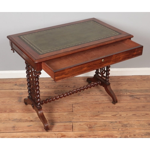 303 - A Victorian rosewood writing table. Having leather inset top, single drawer and barley twist support... 