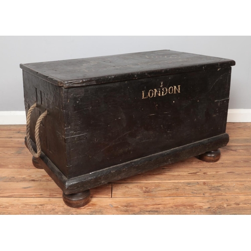 313 - A painted wooden trunk stencilled for British East India Trading Company. Height 55cm, Width 95cm, D... 