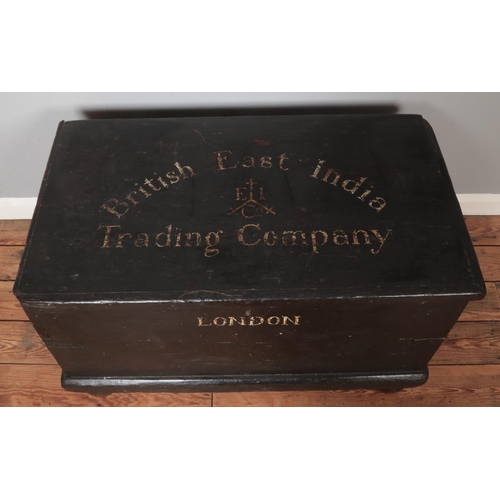 313 - A painted wooden trunk stencilled for British East India Trading Company. Height 55cm, Width 95cm, D... 