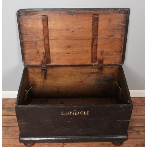 313 - A painted wooden trunk stencilled for British East India Trading Company. Height 55cm, Width 95cm, D... 