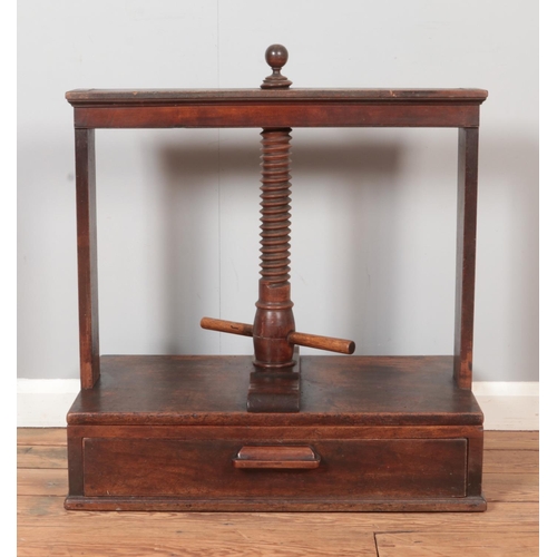 314 - A 19th century mahogany book press with drawer base.