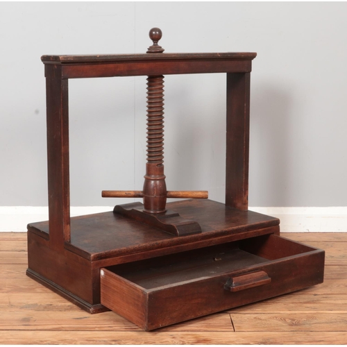 314 - A 19th century mahogany book press with drawer base.