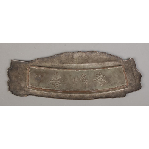 56 - A Japanese Meiji period bronzed pen tray formed as a scholar holding a scroll. Bearing character mar... 