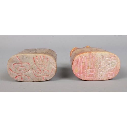 57 - Two 19th century carved soapstone seals, both surmounted with animals, one a water buffalo, the othe... 