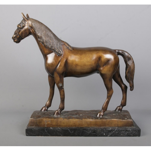 62 - After Piere Jules Mene, a large bronze sculpture of a horse raised on marble base. Signed P J Mene, ... 