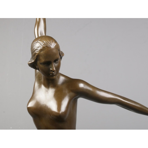 64 - After Georges Duvernet, a bronze sculpture of a nude dancing maiden, raised on stepped plinth marble... 