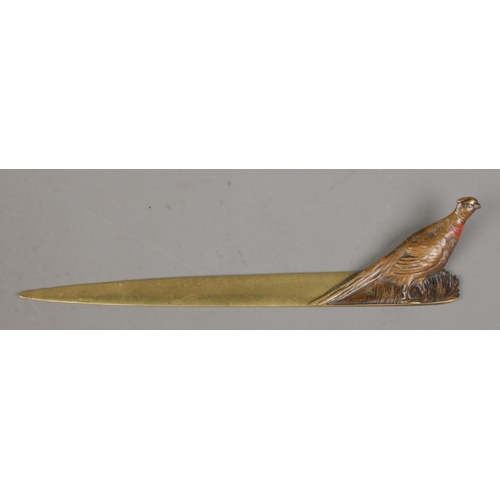 72 - A bronze letter opener decorated with a cold painted pheasant. Stamped Made In Austria to underside.... 