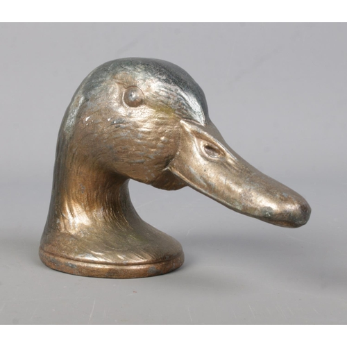 73 - A cast metal novelty bottle opener formed as a Mallard head, titled 'Ducky' by Kirby, Beard & Co, Pa... 