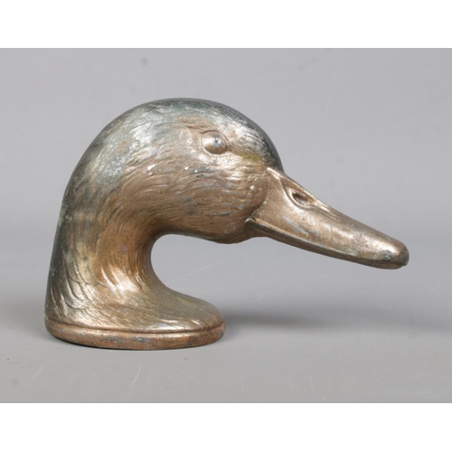 73 - A cast metal novelty bottle opener formed as a Mallard head, titled 'Ducky' by Kirby, Beard & Co, Pa... 