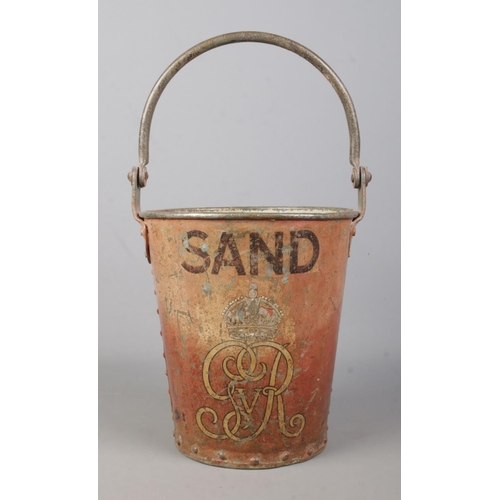 76 - A George V metal fire bucket. Stencilled 'SAND' with crowned GRV cypher. Height 24cm.