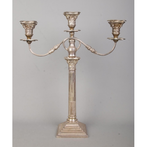 97 - A large George V silver twin branch candelabra with Corinthian column and stepped base. Assayed Lond... 